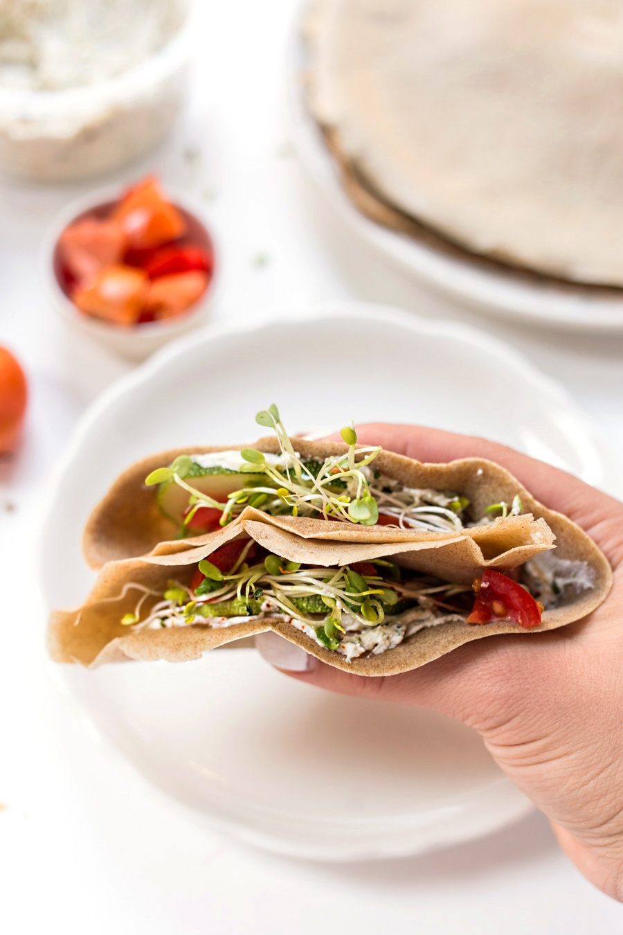 Teff Crepes filled with cream cheese, tomatoes & sprouts -- via @kingarthurflour