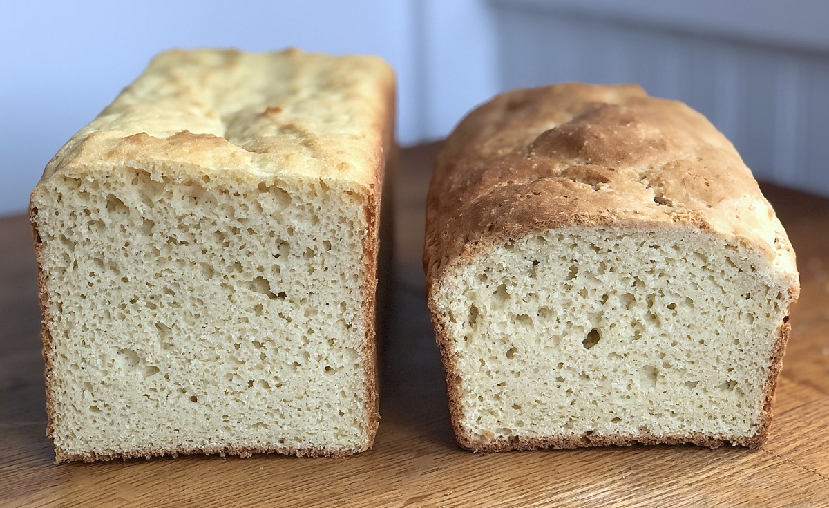 Two loaves of gluten-free sandwich bread baked in different pans, side by side, for height comparison