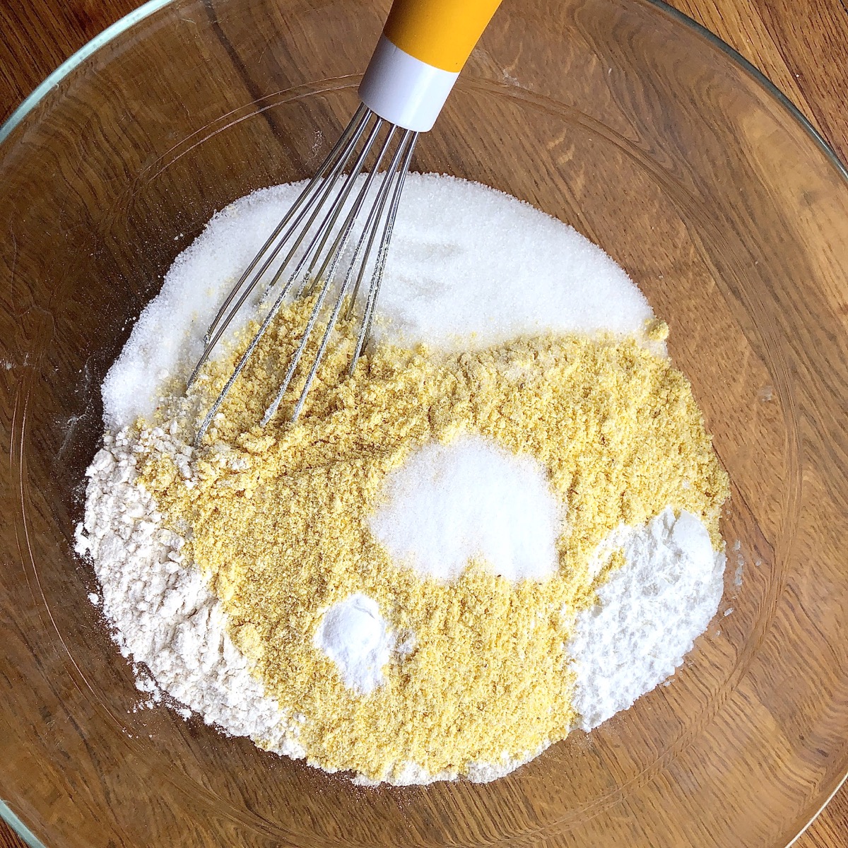 Dry ingredients for cornbread in a bowl ready to be whisked