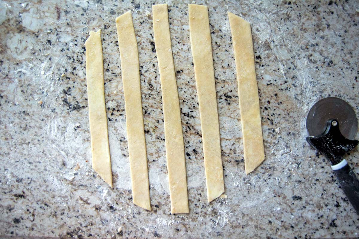 Half the strips of dough