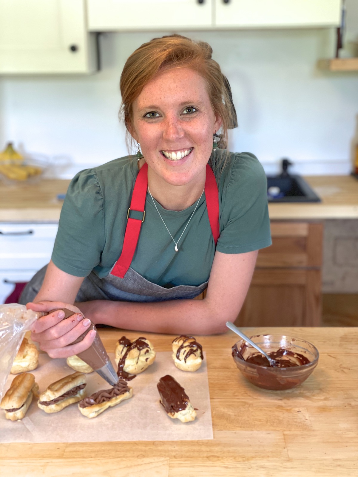 King Arthur baker Kye Ameden showing how to frost eclairs.