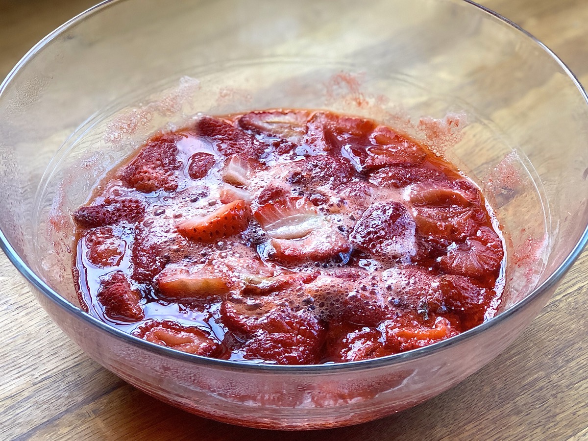 Bowl of cut strawberries and sugar cooke din the microwave for 5 minutes.