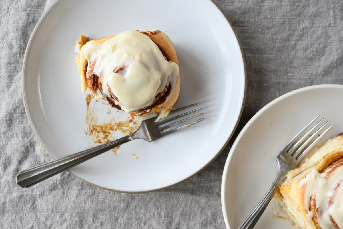 Sourdough cinnamon buns on table.