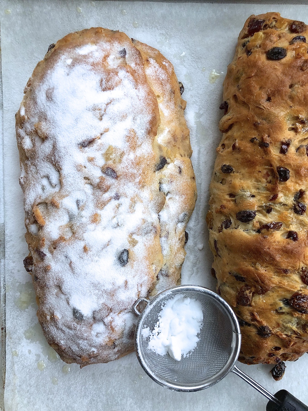 Finished stollen brushed with butter and showered with superfine sugar.