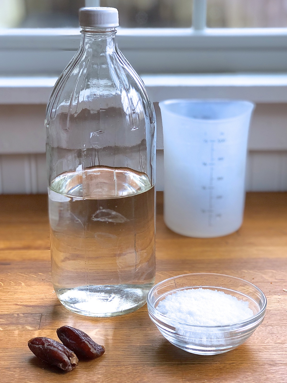 Dried dates, sugar, and water ready to pour into a 32-ounce bottle.