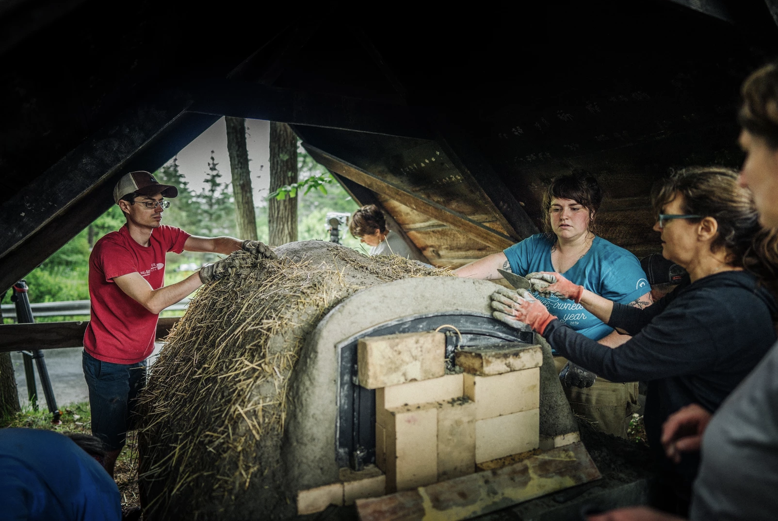 King Arthur volunteers building mud oven