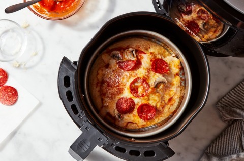 Pizza baking in an air fryer
