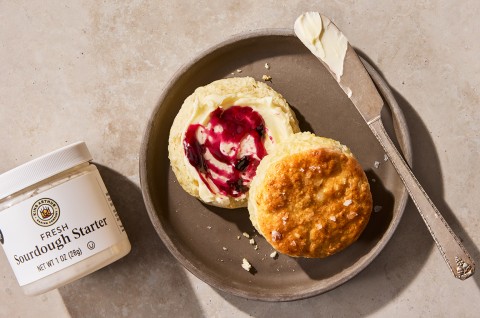 Sourdough Discard Buttermilk Biscuits on a plate with jam and butter - select to zoom