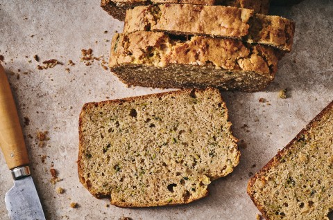 Almond Flour Zucchini Bread sliced on parchment - select to zoom
