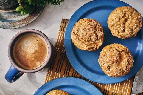 Cream Cheese Carrot Cake Muffins on a plate with a cup of coffee - select to zoom