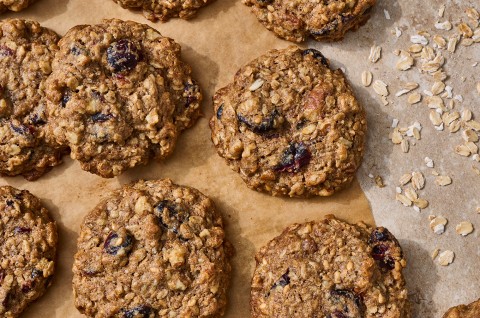 Oatmeal and Flax Cranberry Cookies on parchment - select to zoom