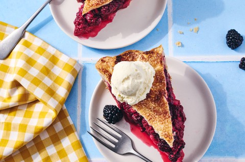 A slice of Gingery Blackberry Pie on a plate - select to zoom