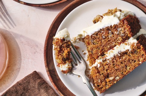 King Arthur's Carrot Cake sliced on a plate with a fork taken out of it - select to zoom