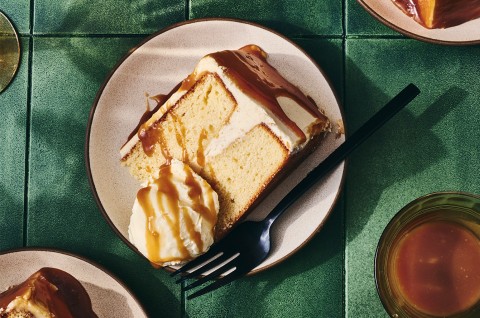 A slice of Caramel Layer Cake with Brown Butter Frosting on a plate with ice cream - select to zoom