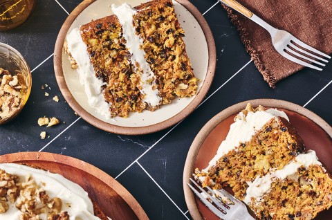 Slices of Gluten-Free Carrot Cake with Cream Cheese Frosting on plates - select to zoom