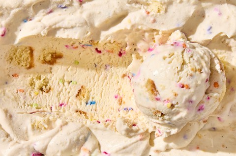 Birthday Cake Ice Cream in a container with a scoop - select to zoom