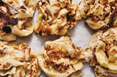 Buss Up Shut (Paratha Roti) on a sheet of parchment - select to zoom