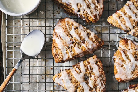 Cinnamon Whole Wheat Scones on a cooling rack after being glazed - select to zoom