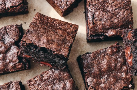 Deep-Dark Fudgy Brownies on parchment paper - select to zoom