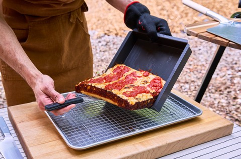 Pizza Oven Detroit Pizza coming out of the pan - select to zoom