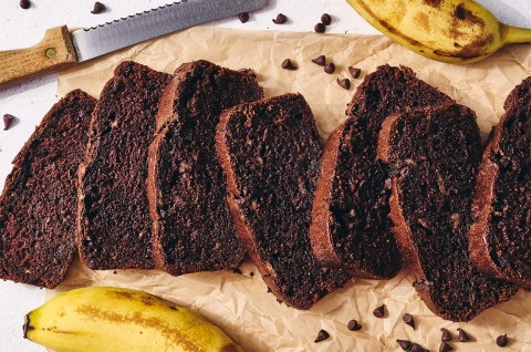 Double Chocolate Banana Bread sliced on a cutting board - select to zoom