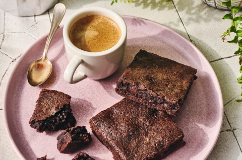Quick and Easy Brownies on a plate with a cup of coffee - select to zoom