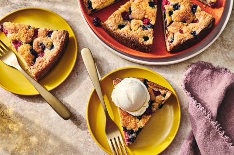 Slices of Late Summer Berry Torte on plates with a scoop of vanilla ice cream - select to zoom
