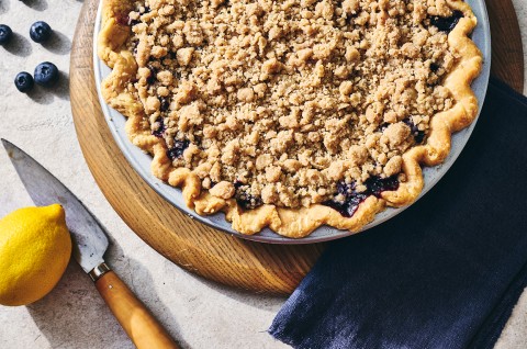 Lemon-Blueberry Streusel Pie in a piece dish on a cutting board - select to zoom