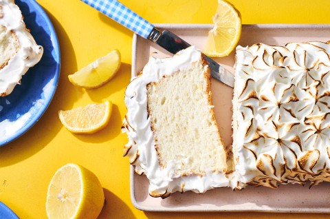 Lemon Angel Food Cake with Meringue Topping sliced on a serving tray - select to zoom