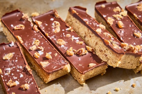 No-Bake Chocolate and Date Energy Bars on parchment paper - select to zoom