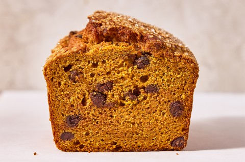 A loaf of The Most Pumpkin Pumpkin Chocolate Chip Bread cut into showing the interior - select to zoom