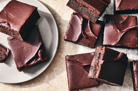 Zucchini Brownies sliced and on a plate - select to zoom