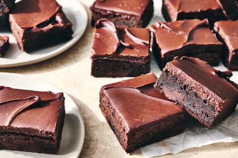 Zucchini Brownies sliced and on a plate - select to zoom