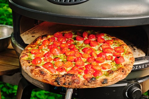 Pizza being baked in a Gozney pizza oven 