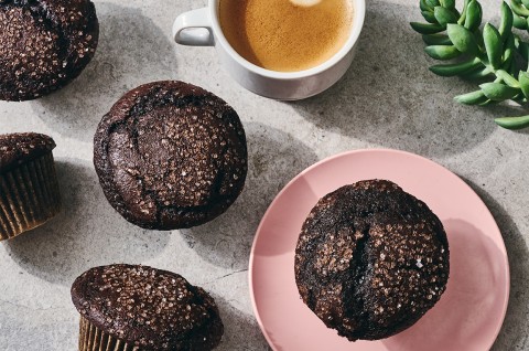 A Chocolate Breakfast Muffin on a plate with a cup of coffee - select to zoom