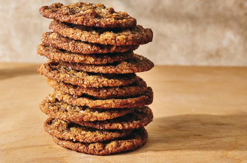 Side photograph of a stack of Cape Cod Soft Molasses Cookies. - select to zoom