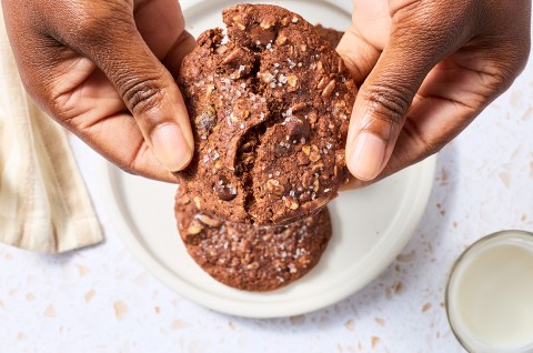 Breaking a Chocolate Lactation Cookie to show the soft texture. - select to zoom