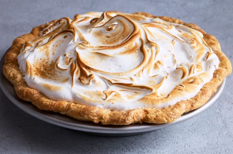 Swirled, baked, and lightly browned Swiss meringue atop a freshly baked pie. - select to zoom