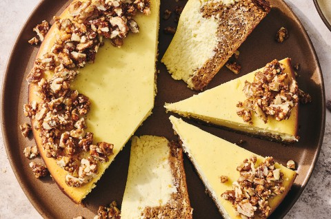 Carrot Cake Cheesecake with golden creamy cheesecake and edged with walnuts. - select to zoom