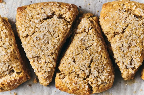 4 Golden Wheat Scones arranged in a pattern on parchment paper. - select to zoom
