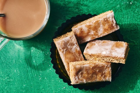 Lebkuchen bars on a plate with a beverage in the corner of the corner of the photo. - select to zoom