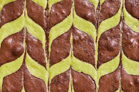 Detailed overhead shot of mint brownies showing a minty feathered pattern. - select to zoom
