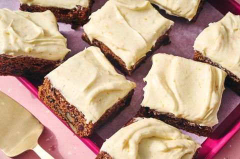 Tomato Soup Spice Cake sliced and shown on a baking sheet. - select to zoom