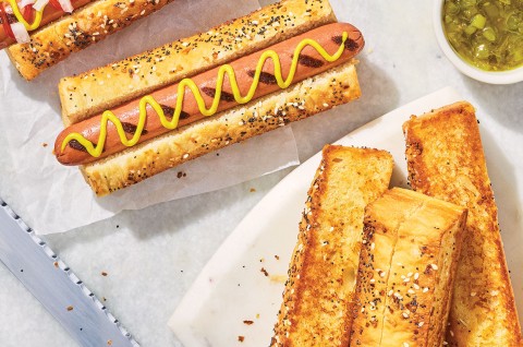 A hotdog and Sourdough Hot Dog Buns on a plate. - select to zoom