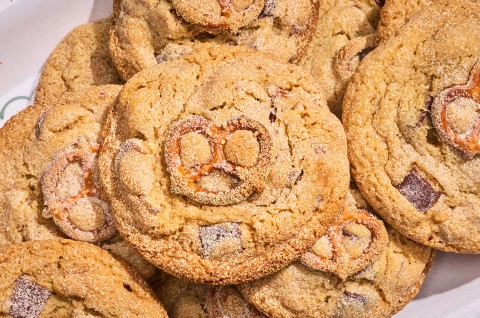 Malted Peanut Butter Chocolate Chip Cookies stacked on a plate - select to zoom