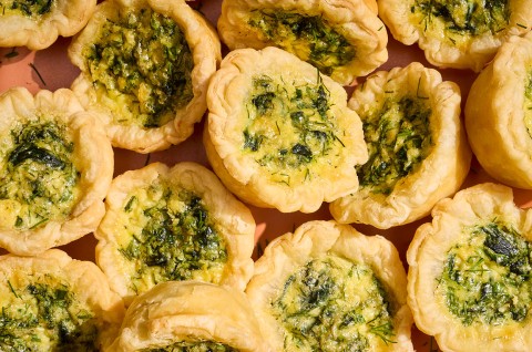 Mini Quiches arranged in a pile seen from above - select to zoom