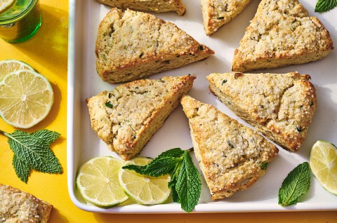 Mojito Scones on a platter with limes and mint leaves decorating the photo. - select to zoom