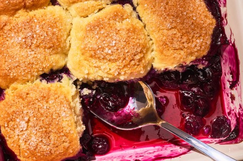 Close-up shot of Sourdough Discard Blueberry Cobbler in a pan - select to zoom