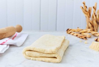 Folded puff pastry dough on the counter