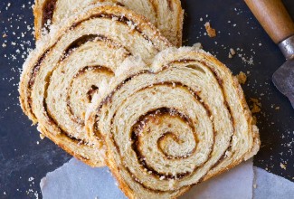 A loaf of cinnamon swirl bread cut into slices